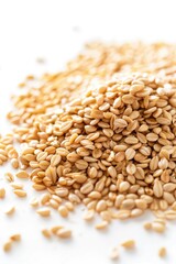 Obraz premium A pile of sesame seeds arranged on a white background, ready for use in various applications