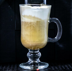 Traditional Italian style cappuccino in a classic crystal glass