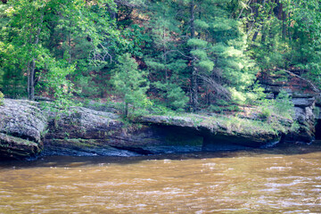 The rocky shoreline of Cambrian sandstone along the Wisconsin River in the Wisconsin Dells.