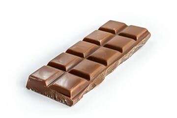A single piece of chocolate sits on a clean white surface