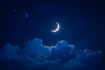 Fototapeta premium Crescent moon dominates night sky, twinkling stars, deep blue clouds illuminated below