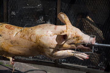 Closeup of roasted pig in barbecue in outdoor