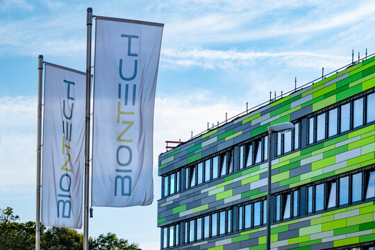 BioNTech headquarters with company flags, German biotechnology company, BioNTech Manufacturing, development and production active immunotherapeutic agents in Mainz, Germany - September 7, 2024