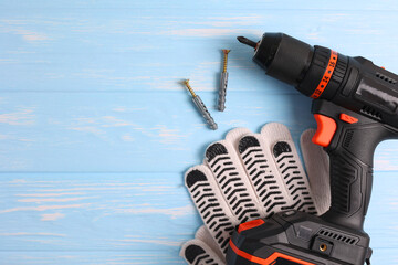 Cordless Drill Featuring Various Drill Bits Set Against a Vibrant Blue Background