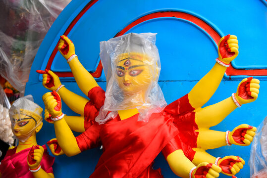 Idol of Goddess Devi Durga at a decorated puja pandal in Kolkata, West Bengal, India. Durga Puja is a famous and major religious festival of Hinduism that is celebrated throughout the world.