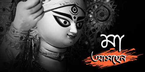 Idol of Goddess Devi Durga at a decorated puja pandal in Kolkata, West Bengal, India. Durga Puja is...