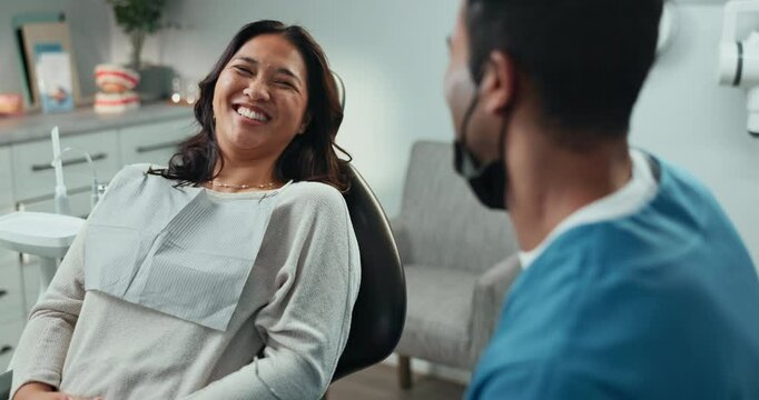 Consultation, doctor and patient at dentist appointment in checkup or procedure in hospital or oral care clinic. Happy people, smile and dental hygienist for teeth cleaning or root canal treatment