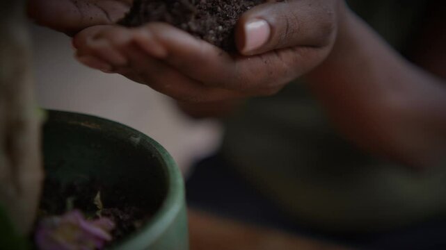 Hands Holding Rich and NutrientDense Soil for the Purpose of Sustainable Gardening Practices
