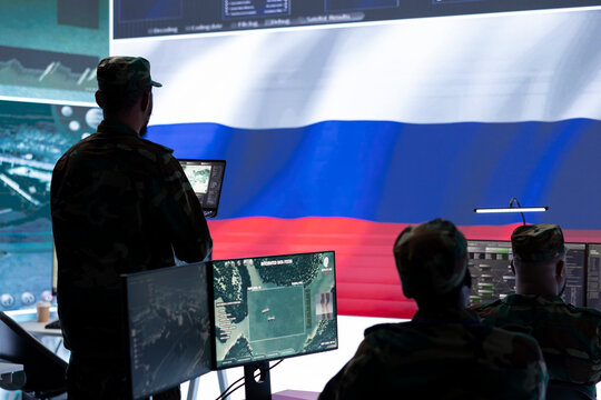 Russian military commander in high tech government control room spreading fake news and war propaganda, making threats. Russian army soldier stealing classified information and state secrets.