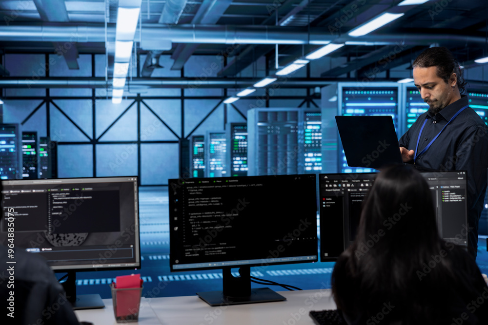 Poster admin doing yearly checkup to prolong data center electronics life span and avoid downtime. employee