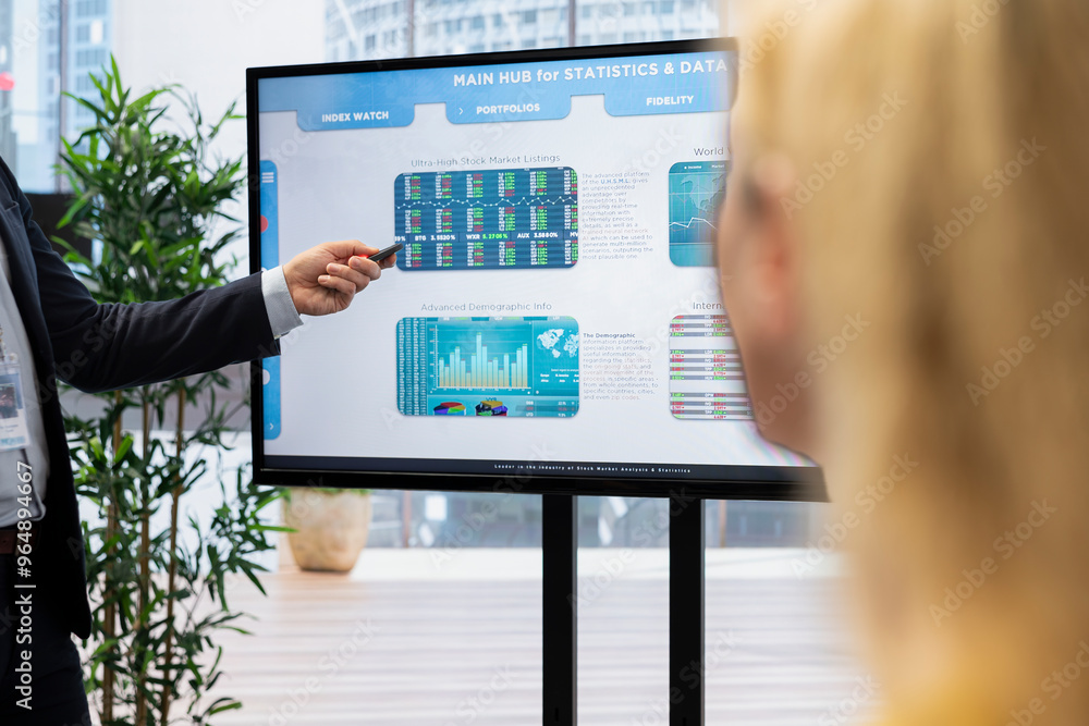 Poster agent presenting stock market diagrams with charts and stock figures on big screen in workplace. bro