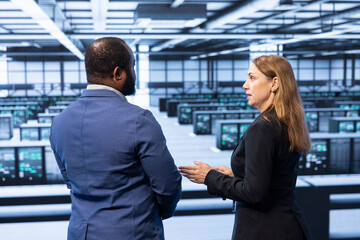 Management executive overseeing data center, checking security enforcement, ensuring business...
