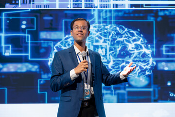 Speaker talking at event bringing together brightest minds in the industry to share insights on...
