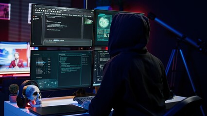 Hacker arriving in underground HQ, ready to start coding malware designed to exploit network...