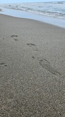 footprints on the beach