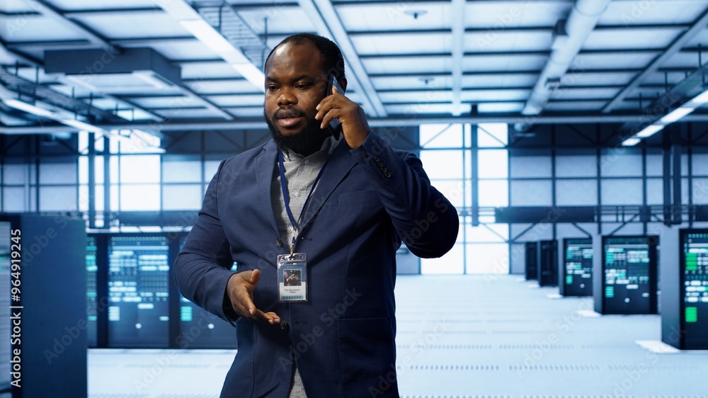 Poster it technician talking on phone in data center, coordinating server maintenance and troubleshooting t