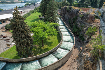 The fish ladder curves through a park at the Rocky Reach Dam on the Columbia River near Wenatchee, Washington, USA