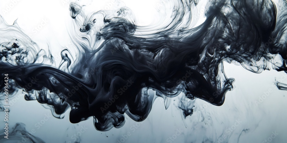 Poster black ink swirls and spreads through water, creating abstract patterns and shapes.