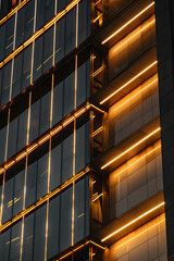 Obraz premium Elegant Architectural Uplighting Showcasing Modern Building Design with Enhanced Texture and Depth using Strategic Lights