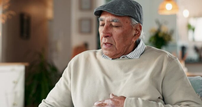 Senior man, chest pain and cough with asthma for cardiac arrest or arrhythmia at home. Closeup, hands and sick elderly male person with flu, cold or bronchitis for viral infection, disease or illness