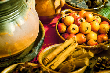 Clay plates containing spices and fruits for making Guatemalan punch.