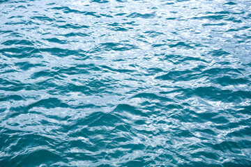 Ocean water. Surface of the sea. Blue ocean or sea water for background. Top view of blue water. Ocean waves for graphic design.