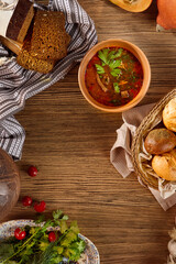 Traditional Kharcho Soup with Beef, Spices, and Rice Garnished with Fresh Herbs