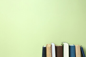 A stack of books on a green background