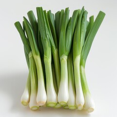 Obraz premium A collection of fresh green leeks on white background.