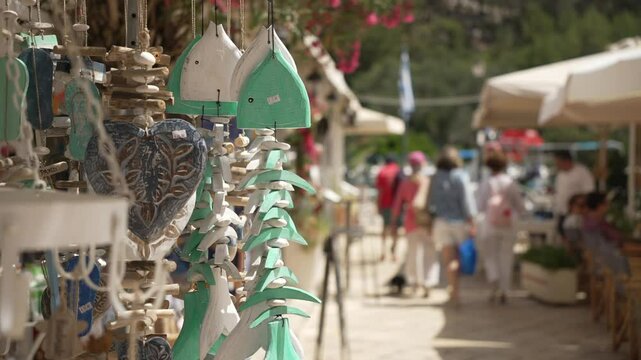 View of souvenirs people out of focus in Plaza de l' Ascension in Gaios Town, Gaios Town, Paxos, Ionian Sea, Greek Islands, Greece, Europe