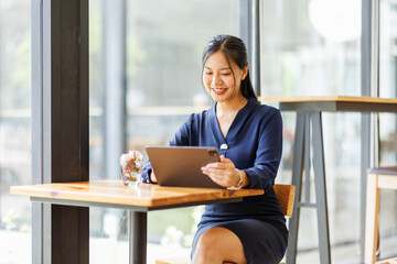 Business asian woman freelancer using tablet with blank screen for design mockup device Tablet with blank screen for design mockup

