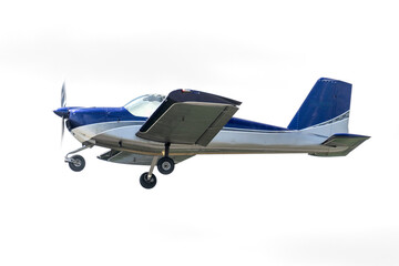 Fly by in a small aircraft. Blue and gray paint on a low wing airplane with fixed gear and propeller. Isolated plane on white background 