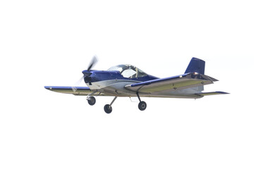 Gray and blue aircraft taking off for adventure. Single engine two seat airplane, it is low wing and fixed gear. Single engine pulled by propeller powered by pistons. a great trainer plane