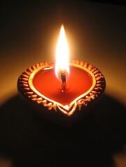 Diwali diya oil lamps with flowers holiday background. Creating a festive and decorative composition.