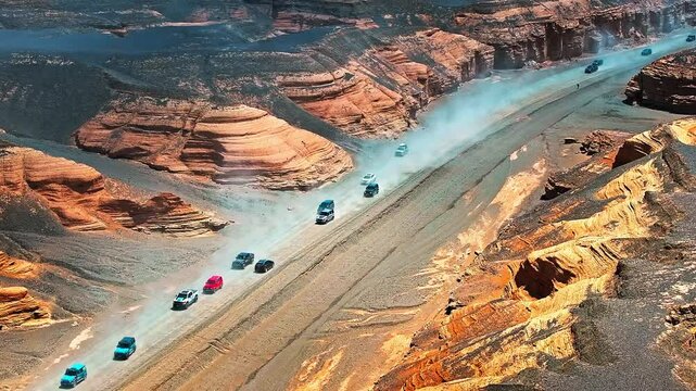 Aerial view of the car passing through a Yadan landform desert road. The spectacular Dahaidao Yadan landform natural landscape in Xinjiang, China. A paradise for self-driving tours.