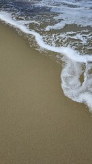 Ocean foam on the beach