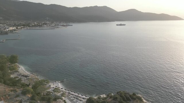 Drone view of Aegean Sea and Thasos Town at sunset, Thassos Town (Limenas), Thassos, Aegean Sea, Greek Islands, Greece, Europe