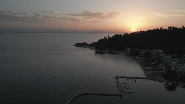 Drone view of Aegean Sea and Thassos Town (Limenas) harbour at sunrise, Thassos Town (Limenas), Thassos, Aegean Sea, Greek Islands, Greece, Europe