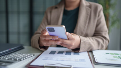 Fototapeta premium Asian woman using smartphone&nbsp;mobile addict spending time checking news social media cell telephone technology e-commerce concept.