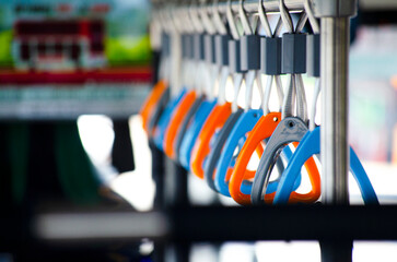 Handles loop for hanging on the train or bus for standing passenger. Public vehicle safety equipment Which is a contact point that can spread germs and the coronavirus