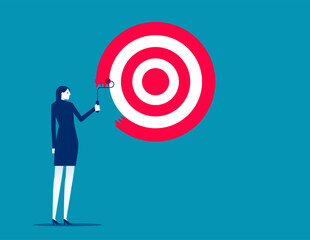 Purpose, set business goal or target, KPI, key performance indicator or set objective, ambitious businessman on ladder using paint roller to paint big dartboard, archery target. Achievement concept