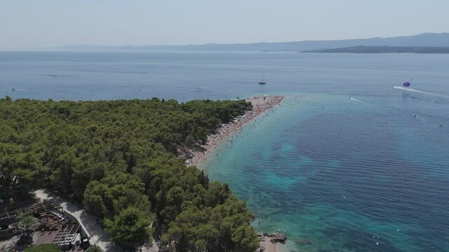 Aerial View of the Paklina Fkk⁩⁦ Beach in Bol on Brac Island, Split Dalmatia, in Croatia. Summer Vacation Resort Near Golden Cape or Golden Horn Zlatni Rat Beach. Famous Adriatic Beach on Adriatic Sea