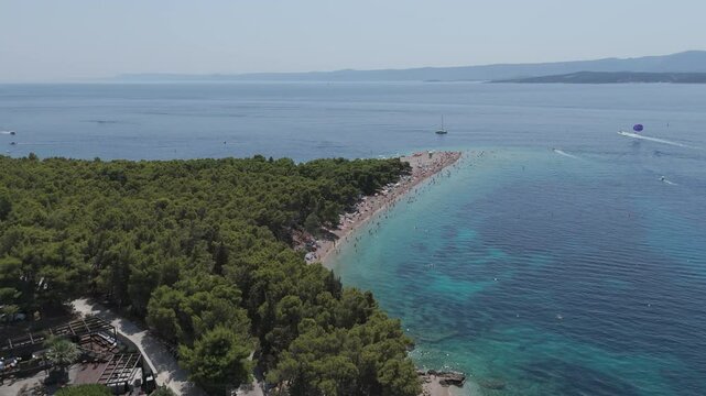 Aerial View of the Paklina Fkk⁩⁦ Beach in Bol on Brac Island, Split Dalmatia, in Croatia. Summer Vacation Resort Near Golden Cape or Golden Horn Zlatni Rat Beach. Famous Adriatic Beach on Adriatic Sea