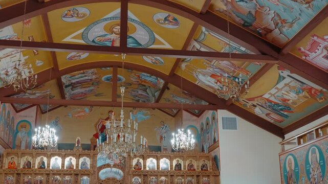 rystal chandeliers illuminate the sacred space, enhancing the golden hues and spiritual ambiance of this Eastern Christian sanctuary. Illinois, USA