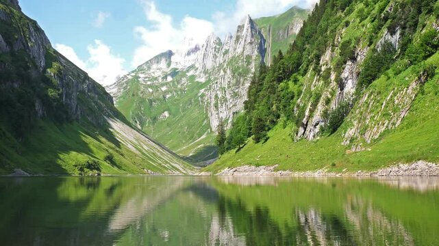 Timelapse of F&auml;lensee (or F&auml;hlensee), a serene lake nestled in a narrow valley between Hundsteingrat and Roslen-Saxer First in the Alpstein range of the canton of Appenzell Innerrhoden, Switzerland.