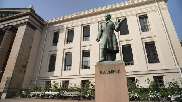 View of Peter Andreas Munch statue and Domus Media in University Square, Oslo, Norway, Scandinavia, Europe
