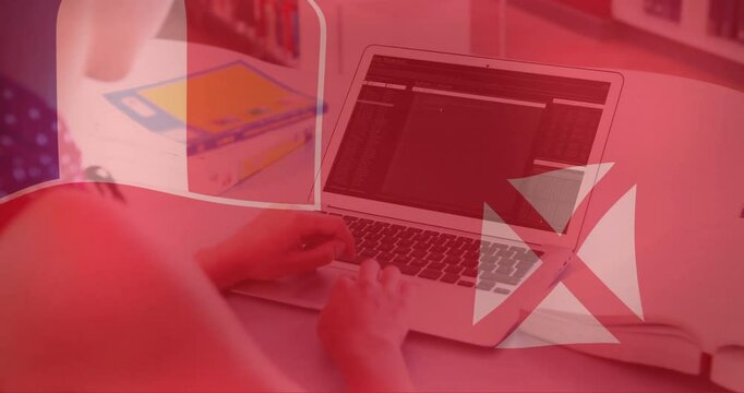 Animation of flag of wallis and futuna over caucasian businesswoman using laptop