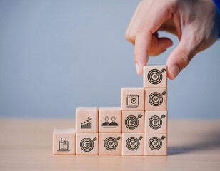 Stack of wooden blocks showing business strategy icons such as arrow target, cog, growth graph, generative ai