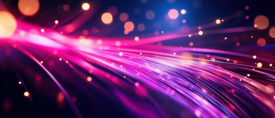 Obraz premium Colorful light trails create a dynamic and vibrant abstract background with bright bokeh effects and glowing particles.