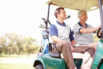 Naklejka premium Smile, drive and men in golf cart together for game, outdoor bonding and fitness on weekend morning. Love, senior dad and son in buggy for sports transport, health and wellness with fun exercise.